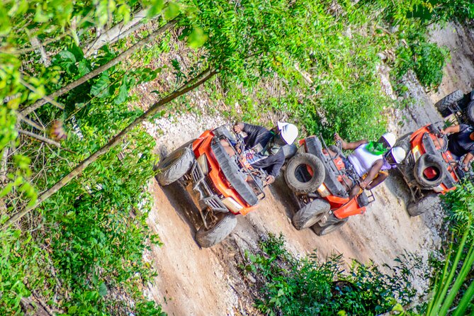 Action-packed Cancun ATV tour, Ziplines, Cenote, Lunch and More - Swimming in an authentic cenote