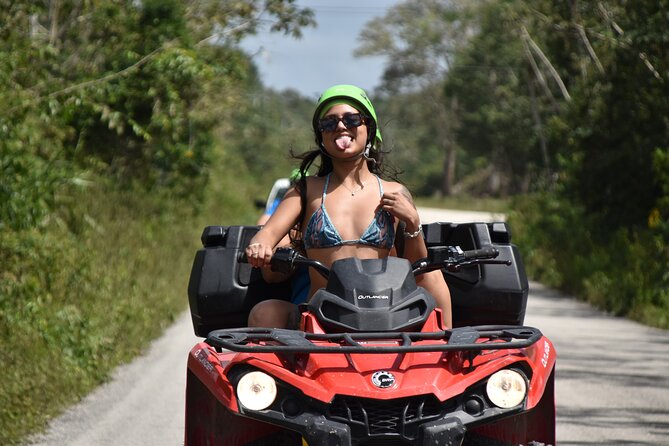 Adrenaline Tour with ATV, Ziplines and Cenote from Cancun - ATV riding on a rough jungle trail