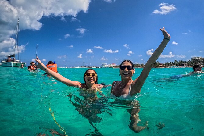 All-Inclusive Isla Mujeres Catamaran with Free Transportation - Lunch, the Blanquizal swim, and beach-club time
