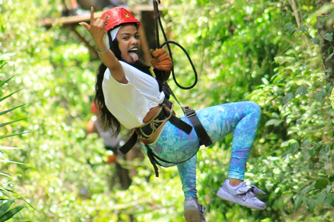 Amazing ATV Tour, Ziplines and Cenote Swim with Lunch and round trip included - Ziplining through the treetops