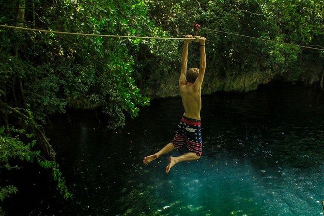 ATV, Ziplines & Cenote with Transportation - Cooling off in a freshwater cenote