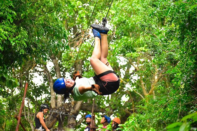 ATV, Ziplines, Tarzan Jump, Lunch and Transportation Day Tour - Entering the cenote by ladder or swing