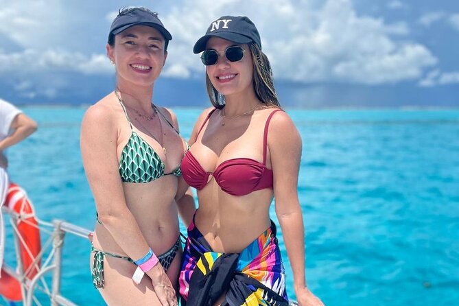 Best Catamaran Isla Mujeres tour with Open bar, lunch, snorkel - Sailing to El Meco Reef