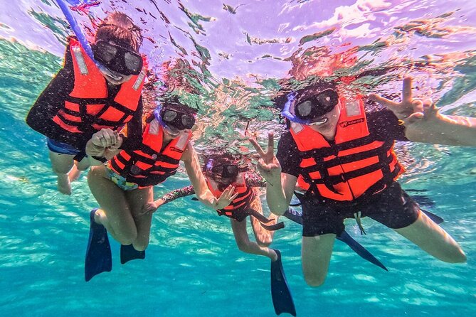 Cancun All Inclusive Catamaran Tour to Isla Mujeres - The spinnaker activity and changing weather
