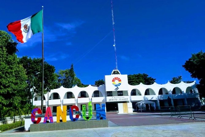 Cancun City Sightseeing and Shopping Tour on a Double Decker bus - Playa Delfines and the Cancun sign