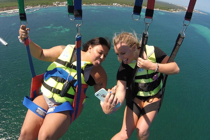 Cancun Parasail Open Schedule - Harnessing up for the flight