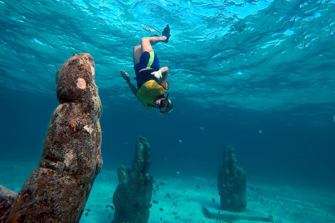 Cancun Snorkeling Adventure: Underwater Museum, Reef & Shipwreck - Getting fitted for masks, fins, and flotation gear