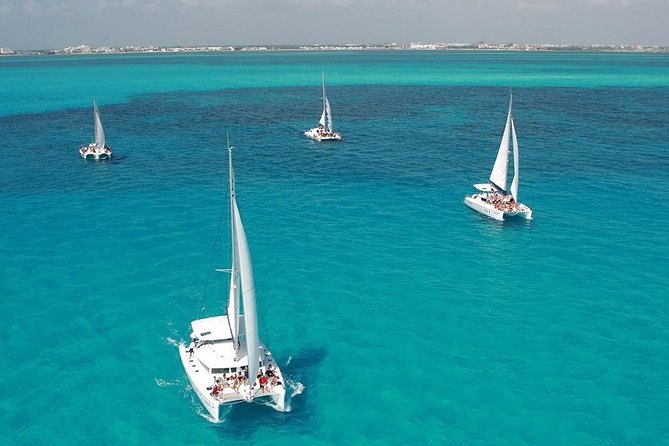 Catamaran adventure to Isla Mujeres with Snorkel,Buffet,Open Bar and Beach Club - The spinnaker activity and the return sail