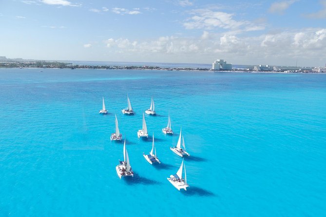 Catamaran Isla Mujeres Tour with Hotel Pick Up included - Snorkeling with tropical fish and coral