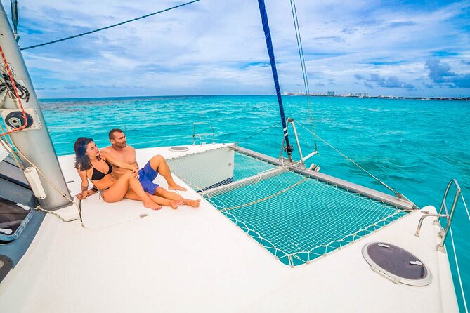 Catamaran to Isla Mujeres Snorkeling Tour with Open Bar and Lunch - Beach-club time and the Mexican buffet