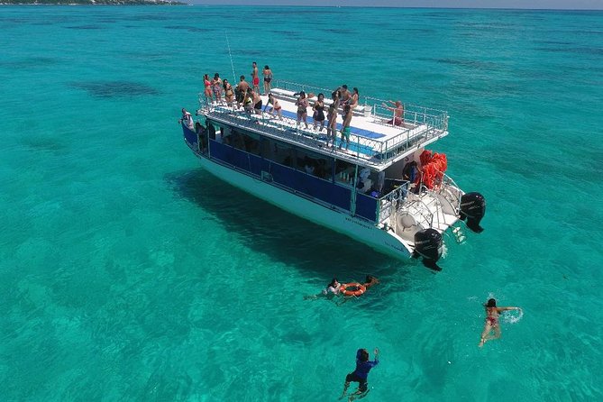 Catamaran Tour to Isla Mujeres all Included - Jumping from the second level and open-water fun