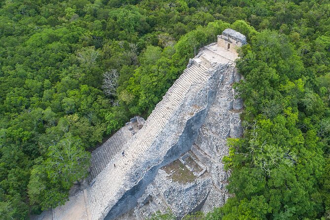 Coba & Mayan Cenote tour with lunch from Cancun and Riviera Maya - Looking closely at temples, ball courts, and carved stones