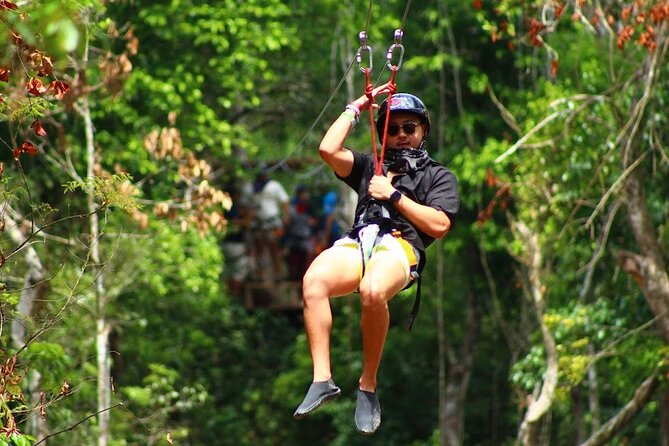 Day Tour with ATV, Zipline and Cenote Adventure from Cancun - Riding the ATV through the Mayan jungle