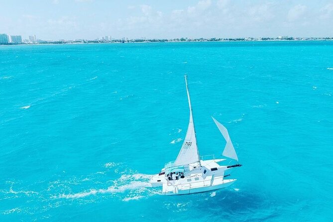 Exciting Catamaran Tour to Isla Mujeres, from Cancún! - Spinnaker flying and the short swim stop