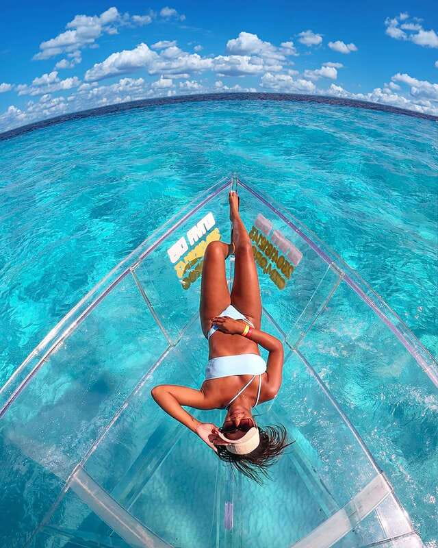 From Cancun: Glass Boat Sightseeing Trip - The guide and the language options
