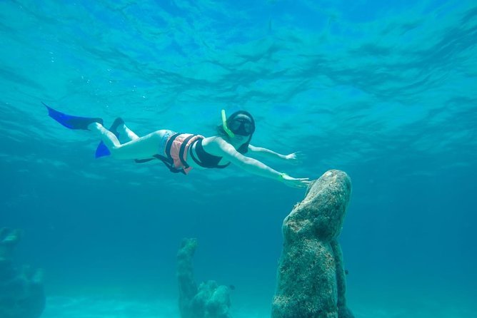 Half Day Sailing Private Catamaran to Isla Mujeres - Pickup, marina costs, and the details that affect the price