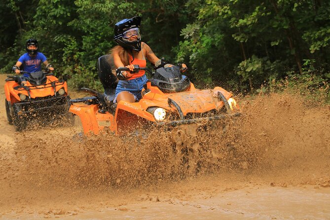 Hidden Cenote Swim & ATV Jungle Adventure with Transportation - A short swim in a clear open-air cenote