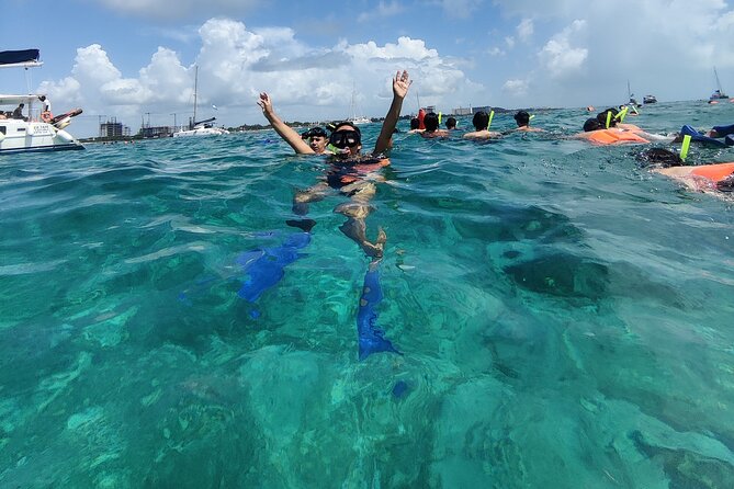 Isla Mujeres Catamaran Tour from Cancun with Snorkel and Open Bar - Snorkeling in the first water stop