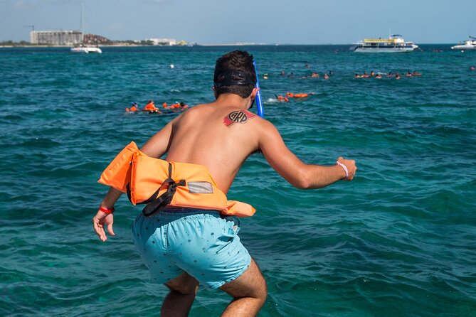 Isla Mujeres Catamaran Tour with Open Bar, Lunch and Snorkeling - Spinnaker rides and the open bar