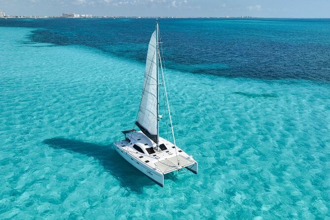 Isla Mujeres Catamaran Tour with Snorkeling, Open Bar & Buffet - Reef snorkeling for about 45 minutes