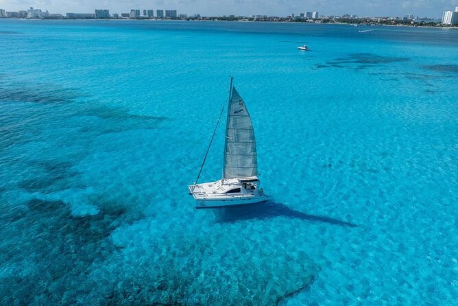 Isla Mujeres Day Tour with Catamaran, Snorkeling & Beach Club - Reef snorkeling in Bahia Mujeres