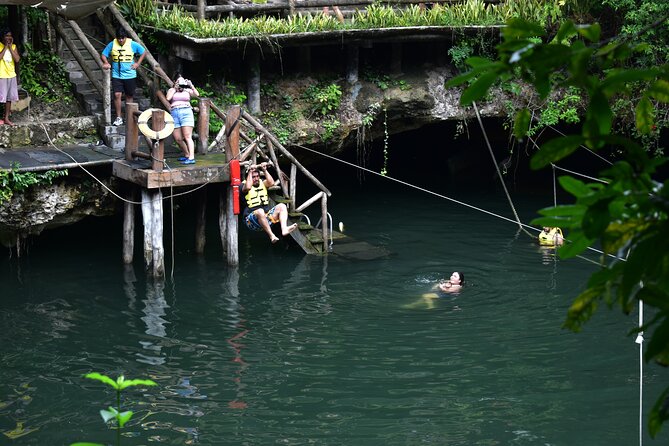 Jungle Adventure from Cancun: ATVs, ziplines, cenote and fun! - Ziplines over the trees