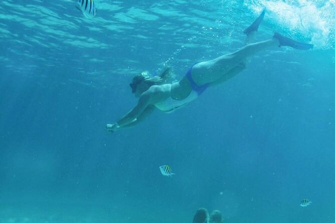 Luxury Catamaran Tour to Isla Mujeres with Transportation - Snorkeling at El Meco reef