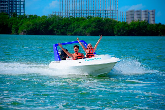Mayan Ritual + Speed Boat Tour + Snacks - Taking the wheel in Nichupté Lagoon