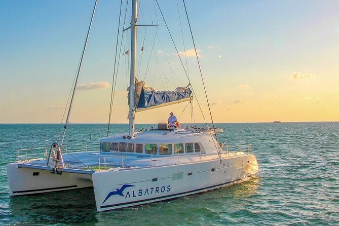 Plus Full Day Catamaran Tour to Isla Mujeres All Inclusive - Lunch, drinks, and the beach-club stop