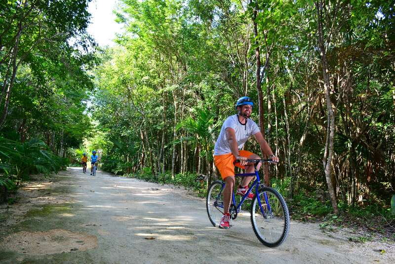 Rio Secreto Nature Reserve: Bicycle, Rappel & Ziplines Tour - Walking into the underground river