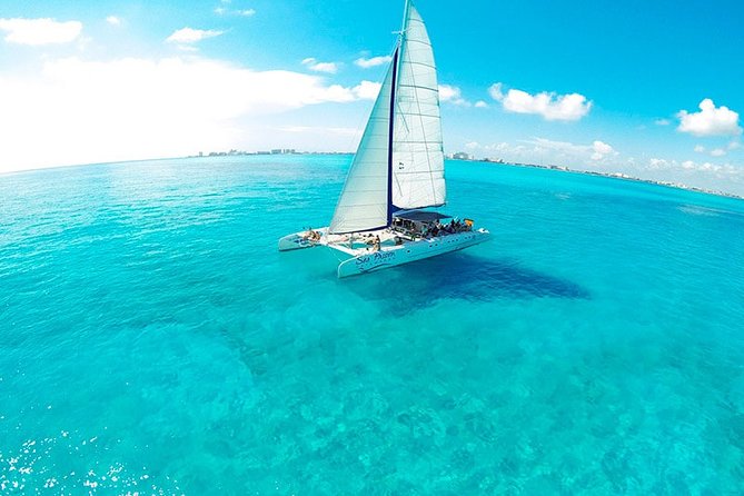 Tour in a Catamaran to Isla Mujeres with all included for the best price! - Spinnaker sailing above the Caribbean