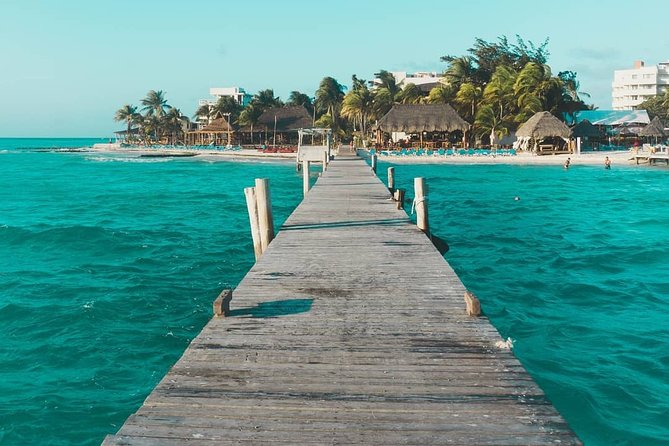 Tour in a Catamaran to Isla Mujeres with all included for the best price! - Weather, cancellations, and practical limits