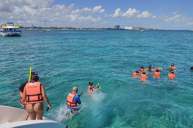 Trip to Isla Mujeres - Catamaran Unlimited Adventure from Playa del Carmen - Playa Norte, beach-club lunch, and pool time